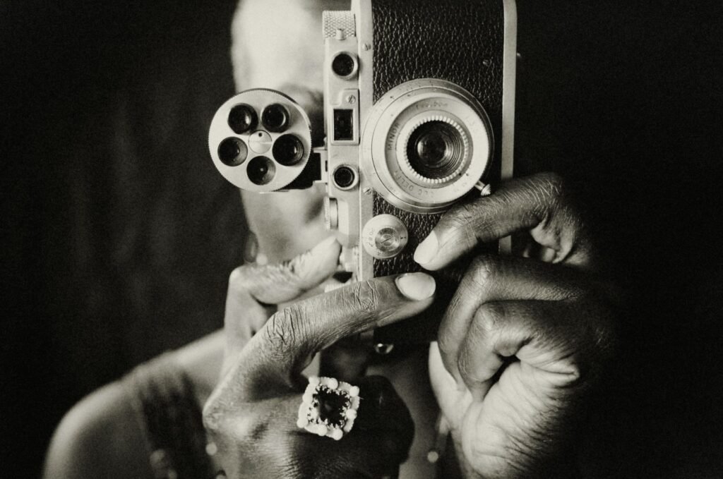 Film camera taking picture. focusing on return of disciplined film finance